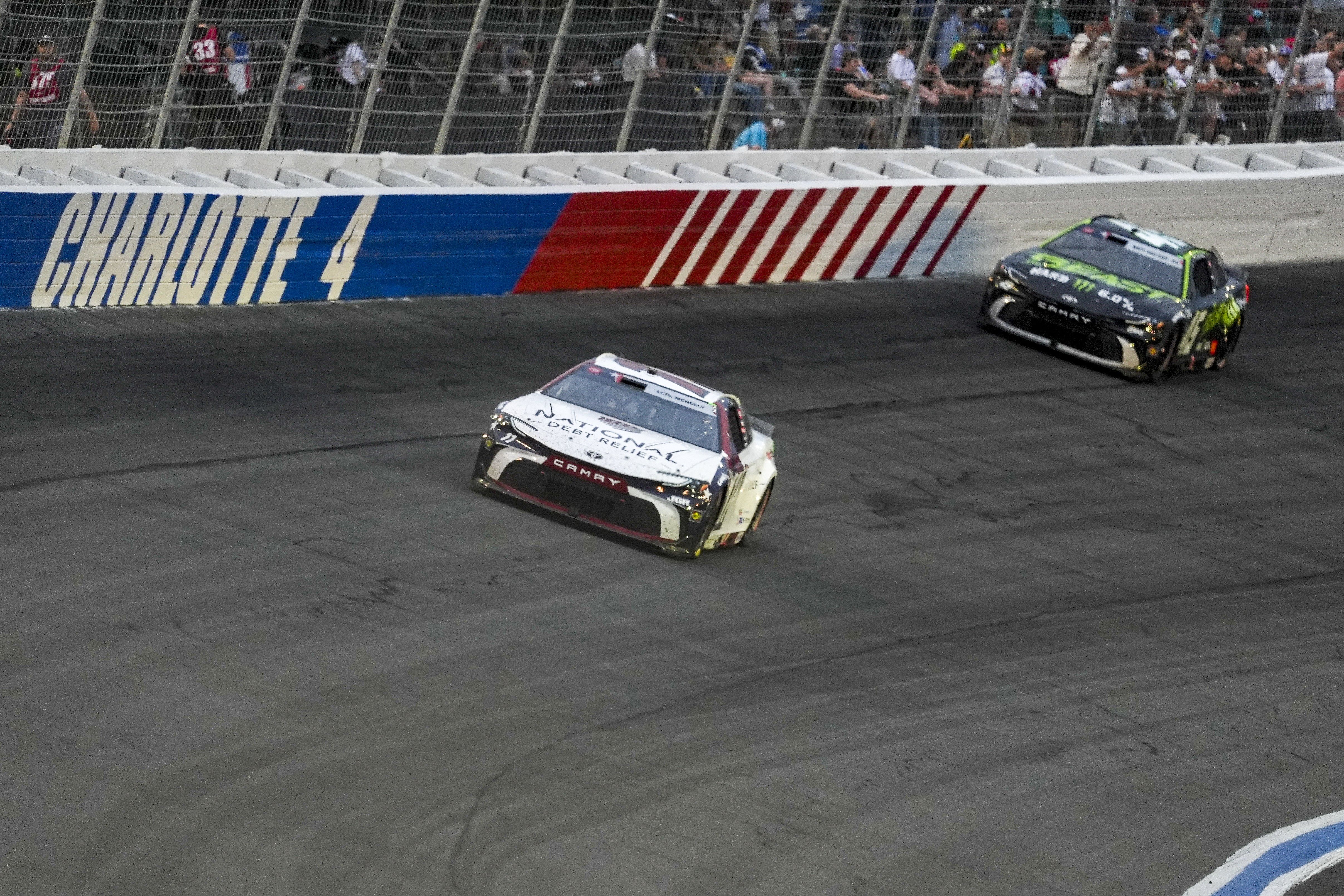 Denny Hamlin (11) overtakes driver Tyler Reddick (45) during the Coca Cola 600 at Charlotte Motor Speedway - Source: Imagn